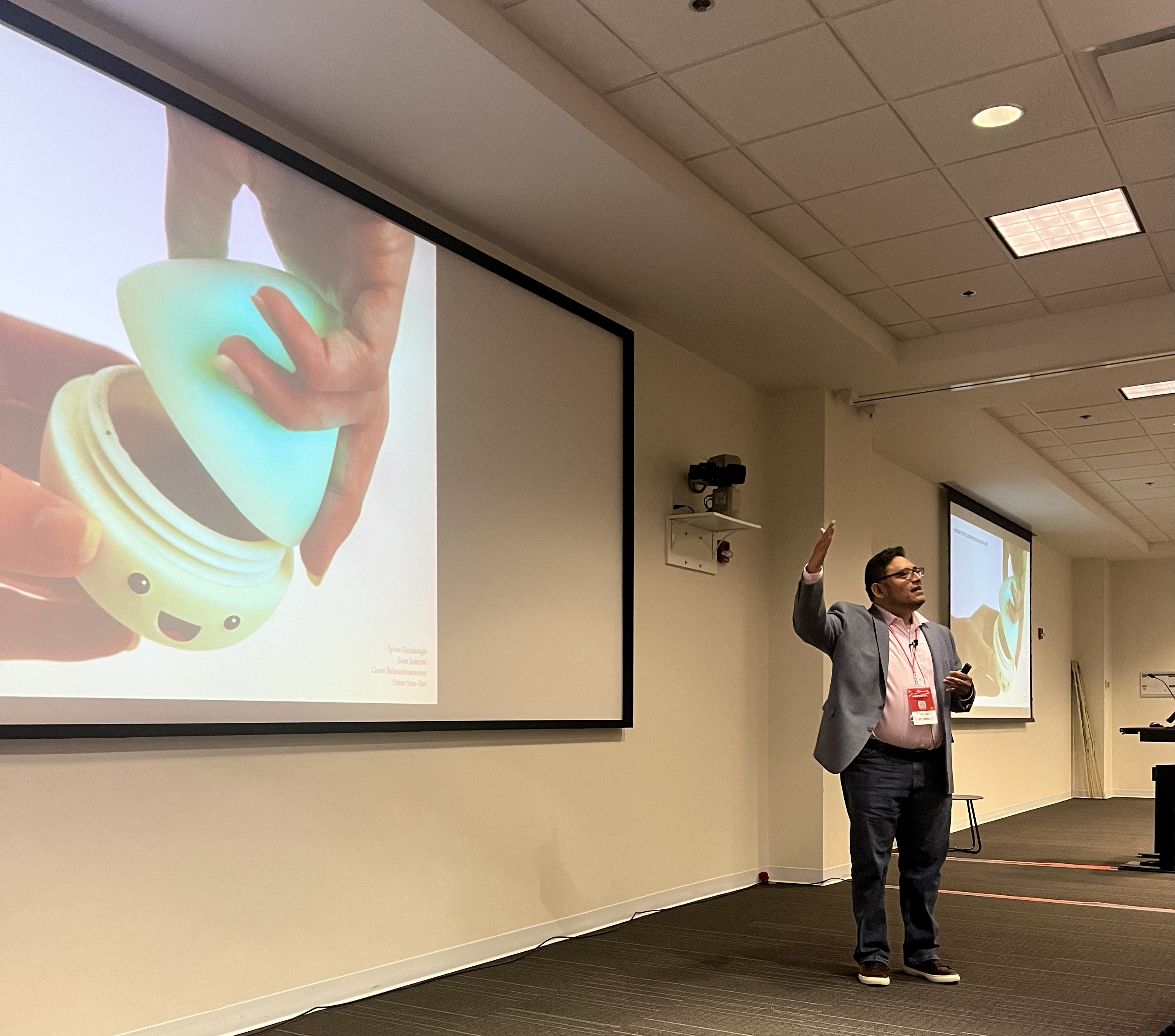 Professor Omar Sosa-Tzec explaining a cute, delightful design that he created with his research assistants to support people with chronic conditions and co-morbidity