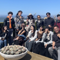 Eleven students from MCTU, with Professor Zun-Hwa Chiang, on a San Francisco rooftop lounge overlooking the Bay