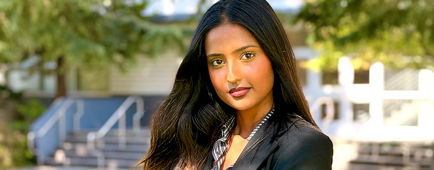 Tamanna Shirol, young woman in a grey suit on SFSU campus