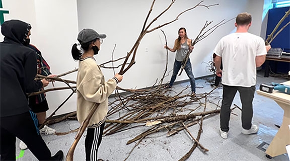 sfsu students installing exhibition piece